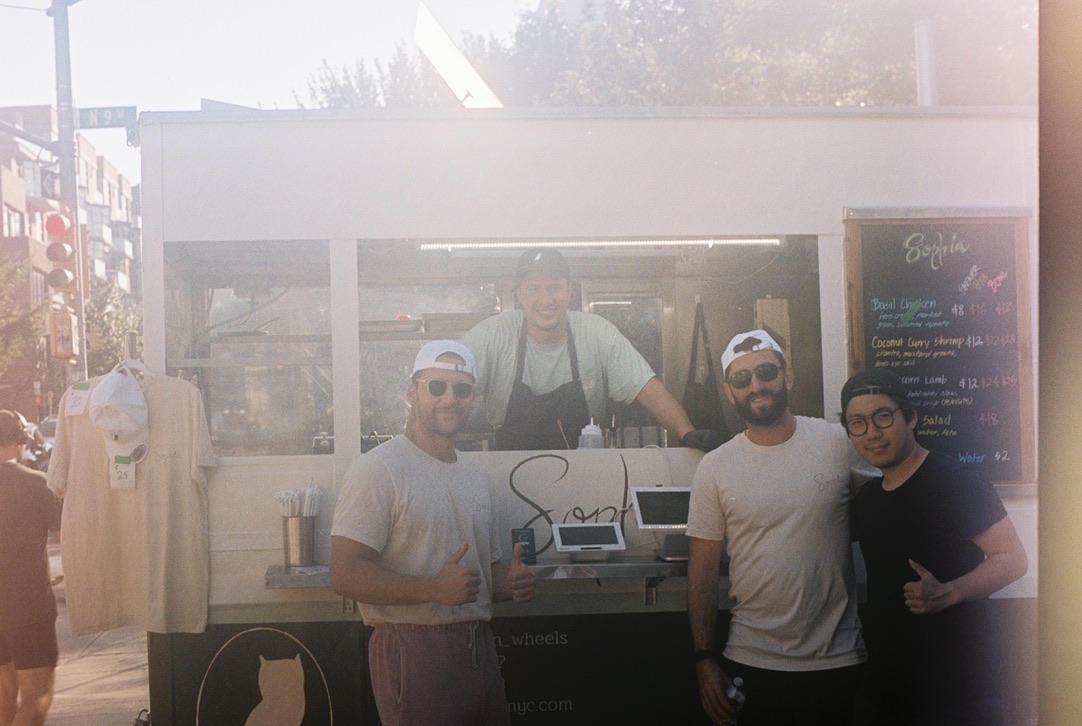 Sophia crew in front of the food cart